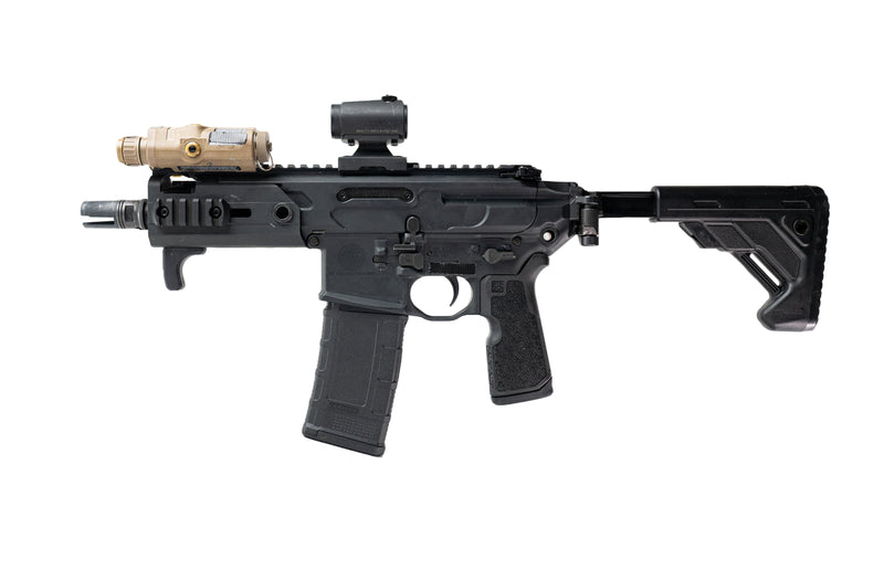 Black rifle with attachments on a white background