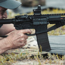 Shooter aiming AR15 with PMAG 30 GEN M3 magazine in use